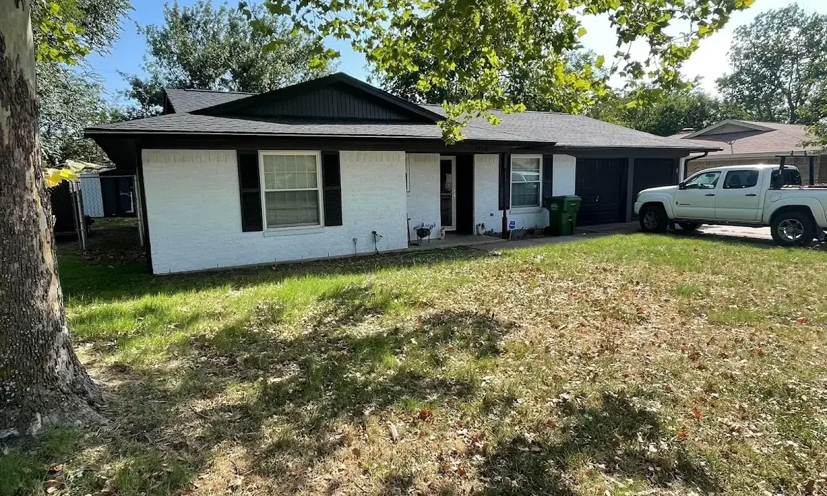Professional roofing crew working on a residential roof in Palmyra